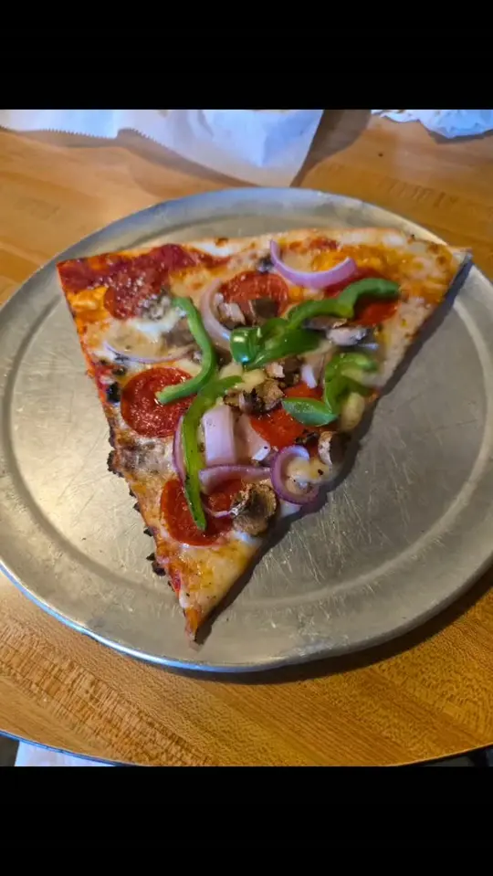 Slices Pizzeria Griffin in Griffin showing pizza, video by Slices Pizzeria Griffin on Facebook