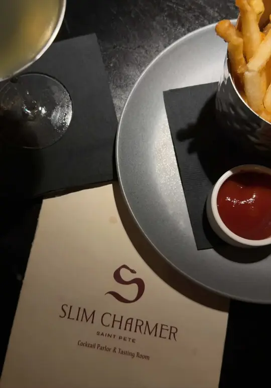 Slim Charmer in St. Petersburg showing dinner, cocktails, fries, video by nicoledipinto on TikTok