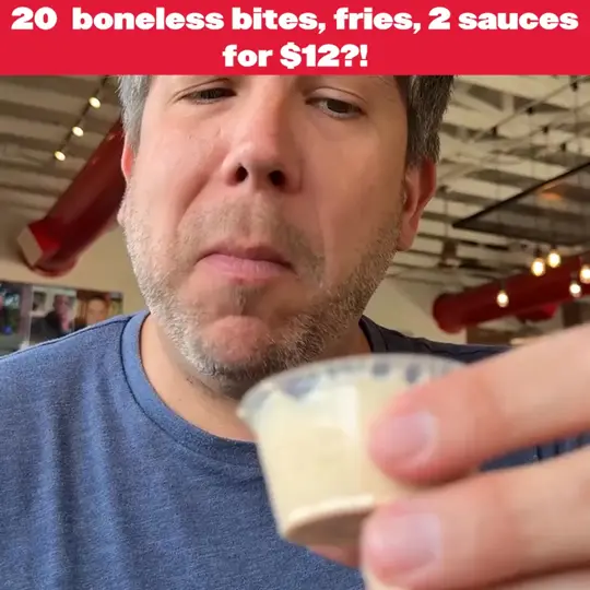 Slim Chickens in Kissimmee showing food, 20 boneless wings, fries, sauces, video by Slim Chickens on Facebook
