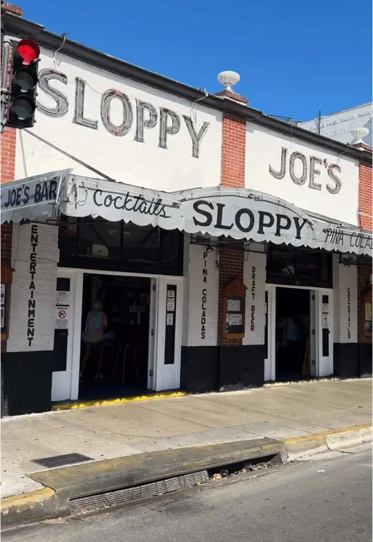 Sloppy Joe's Bar in Key West showing visit, atmosphere, painting, drink, video by backyardsofkeywest on TikTok