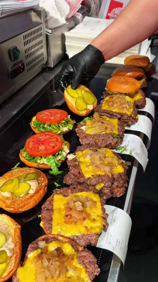 Smash Bros Burgers and Shakes in Miami showing burger, shake, video by smashbros.co on TikTok