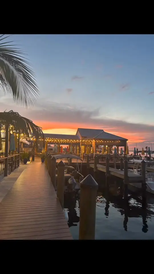 Snug Harbor Waterfront Restaurant in Fort Myers Beach showing restaurant, back bay view, friendly staff, fresh seafood, video by Snug Harbor Restaurant on Facebook