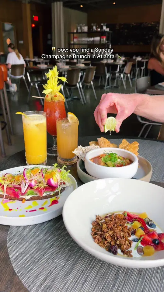 Southern National in Atlanta showing brunch, duck confit hash, shakshuka, champagne pairing, video by atlfoodies on TikTok