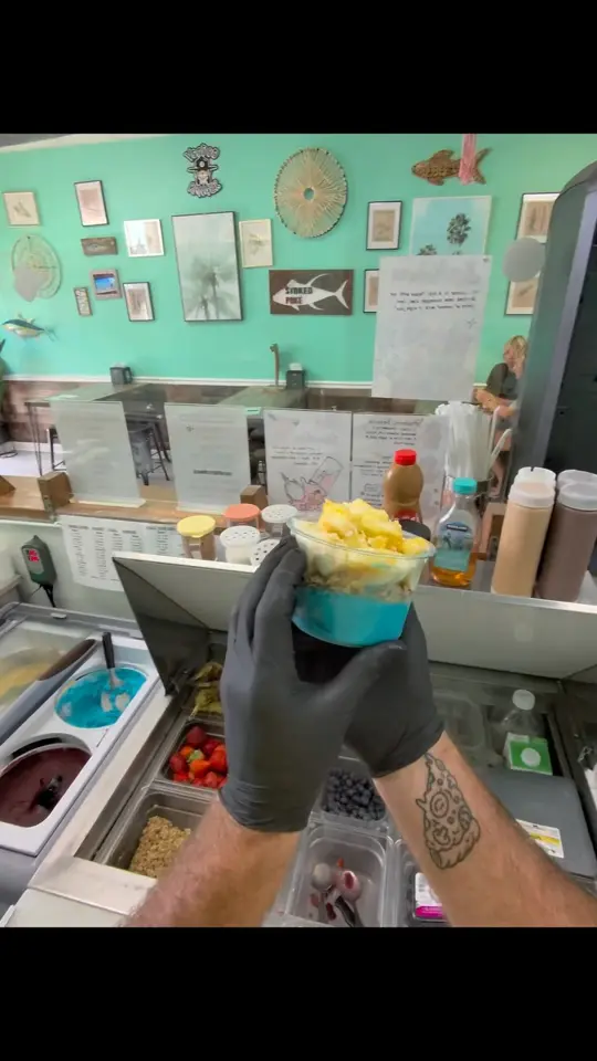 Stoked poke in Port Orange showing food, blue piña colada bowl, video by Stoked Poké on Facebook