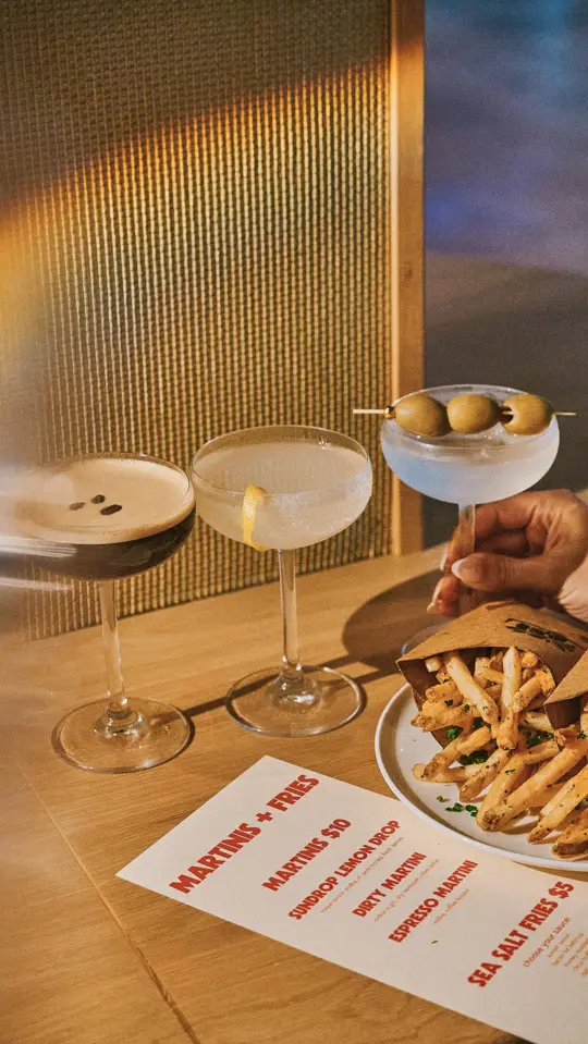 SUNDROP in St. Pete Beach showing cocktail, martini / food, fries, video by The Luce Hotel on Facebook