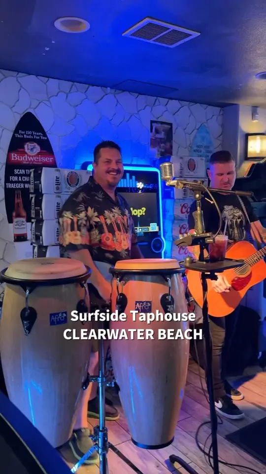 Surfside Taphouse in Clearwater showing live music, dennis and the bad decisions performing, cold drinks, beach vibes, night out, video by Clearwater Beach USA Insider on Facebook