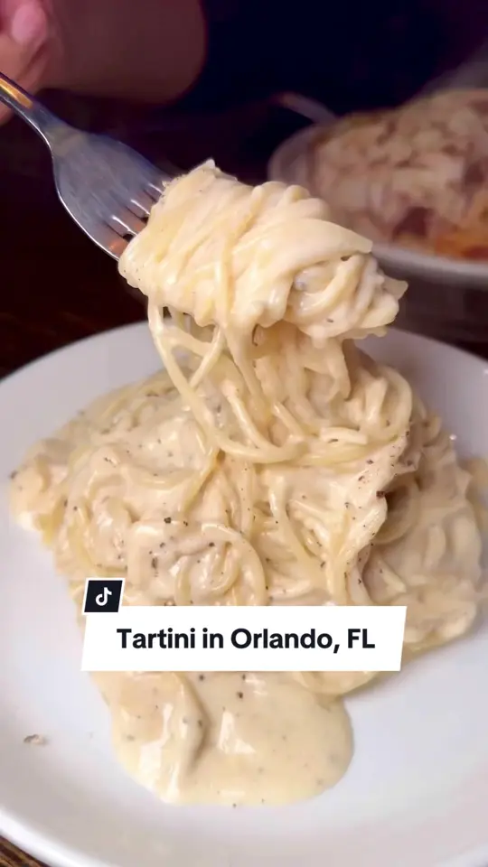 Tartini Pizzeria & Spaghetteria in Orlando showing pasta, cheese wheel pasta, carpaccio, chicken parm, nutella cheesecake, video by christinainitalia on TikTok