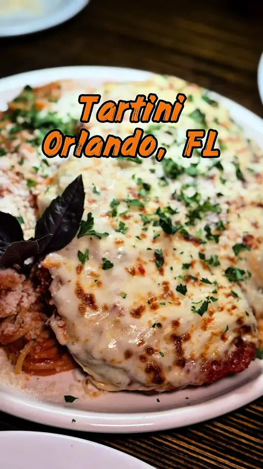 Tartini Pizzeria & Spaghetteria in Orlando showing review, visit, atmosphere, appetizer, calamari fritti, toscana fire bruschetta, video by foodonthespectrum on TikTok
