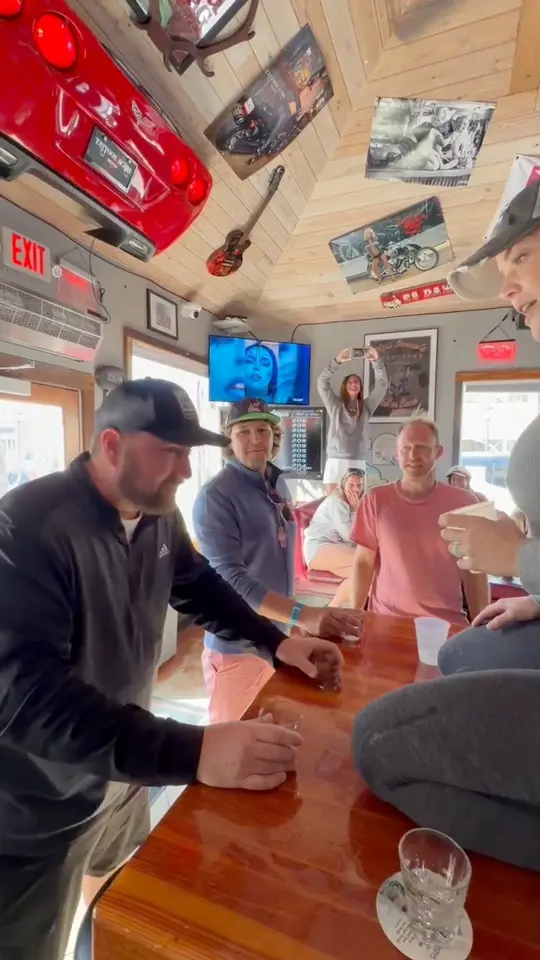 Tattoos and Scars Saloon in Key West showing drink, hurricane shot, video by Island Living: Florida Keys on Facebook