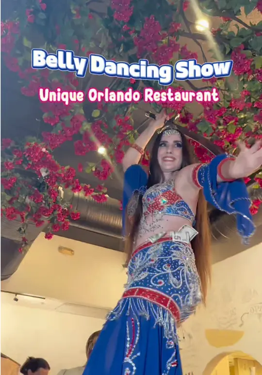 Taverna Opa in Orlando showing live music, belly dancing, dining experience, flaming saganaki, hummus trio, video by neverboredinorlando on TikTok