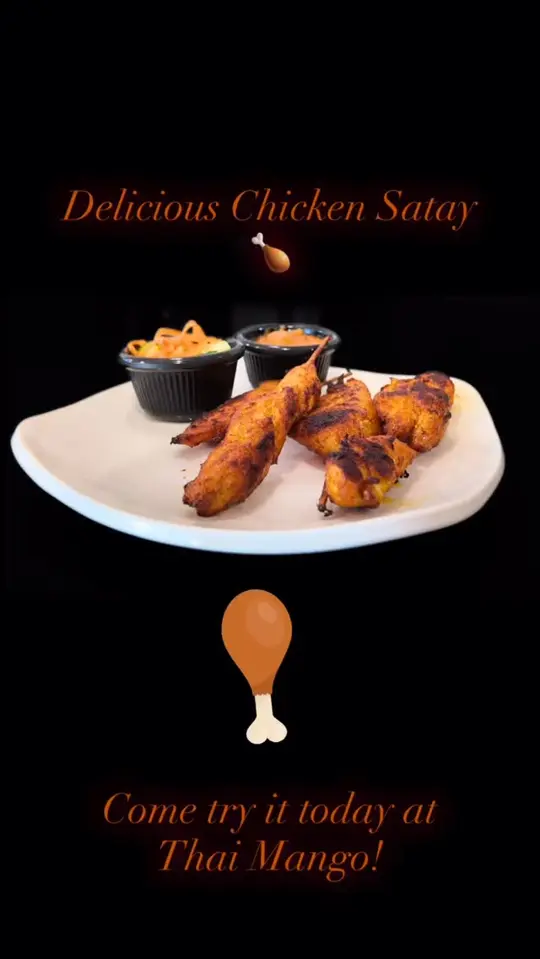 Thai Mango in Canton showing food, golden chicken satay, peanut sauce, cucumber salad, video by Thai Mango Canton on Facebook