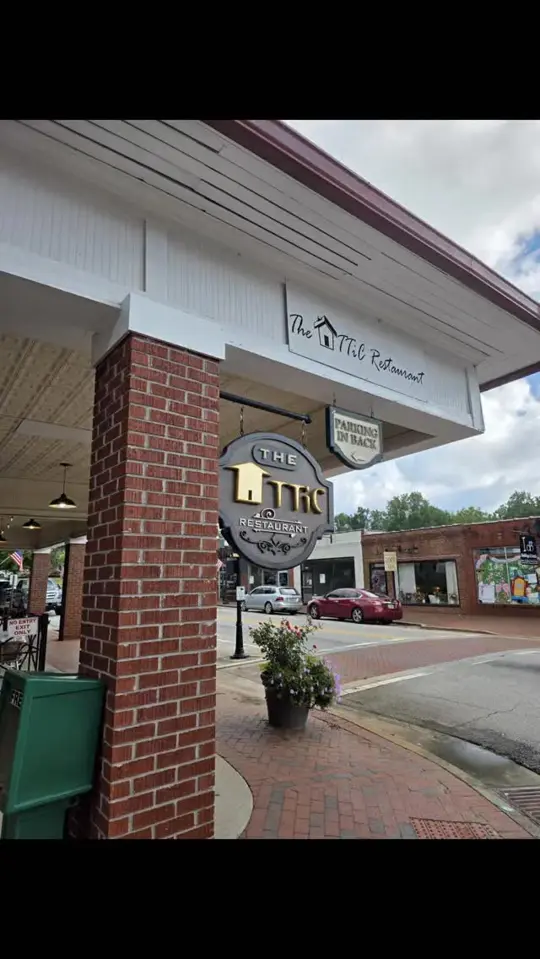 The Attic in Clarkesville showing atmosphere, historic space, red door, cozy charm, video by The Attic on Facebook