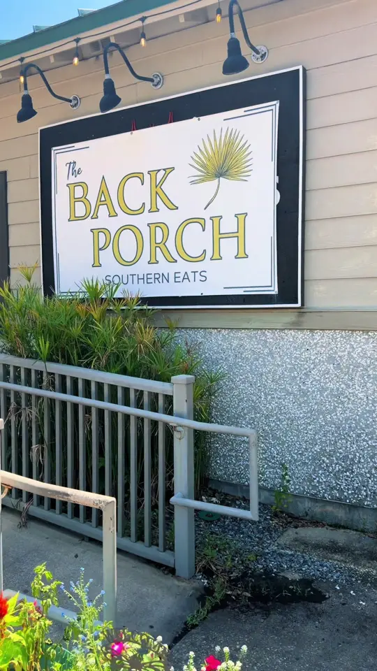 The Back Porch Southern Eats in Fernandina Beach showing review, visit, food, turkey blt on a croissant, sliced brisket, atmosphere, video by tay.privette on TikTok