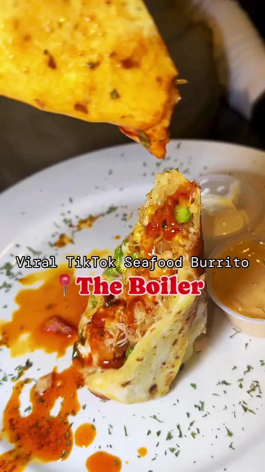 The Boiler Seafood Atlanta in Atlanta showing food, viral seafood burrito, video by servinglooksatl on TikTok