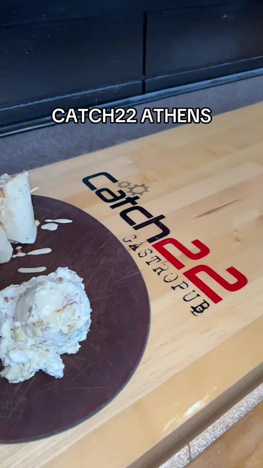 The Catch 22 Gastropub in Athens showing chicken caesar wrap, food, video by catch22gp on TikTok