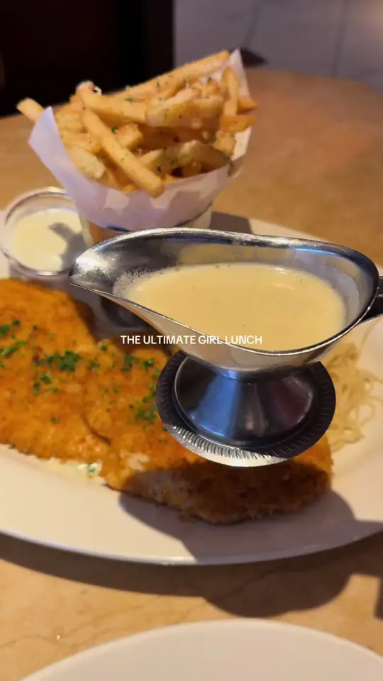 The Cheesecake Factory in Miami showing food review, chicken costoletta, video by emeluchy on TikTok
