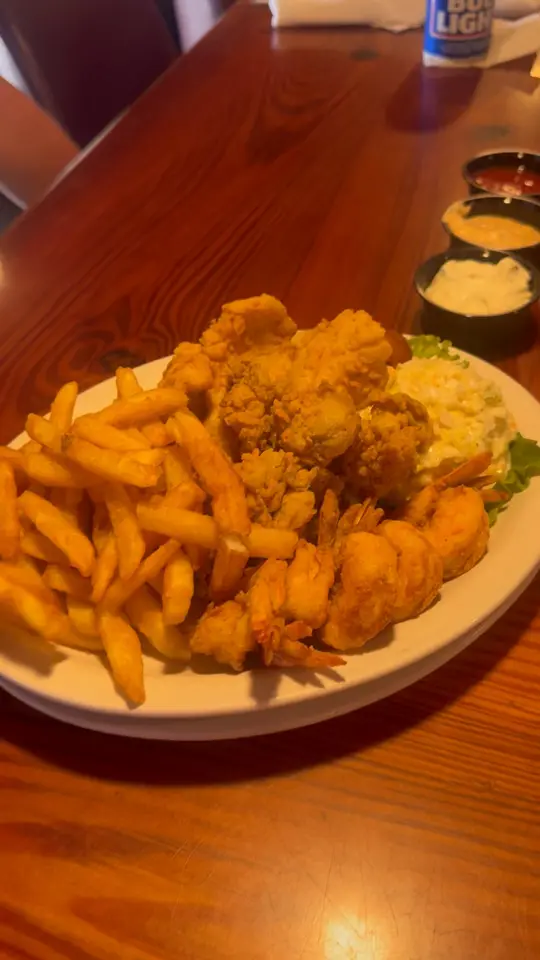 The Cotton Exchange Tavern in Savannah showing seafood platter, drinks, video by Christy Spires Beckom on Facebook