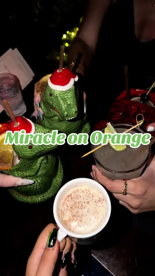 The Courtesy Bar in Orlando showing cocktail, festive decor, video by samanthalongton on TikTok