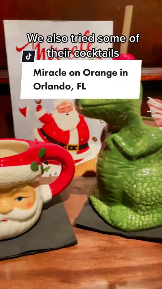 The Courtesy in Winter Park showing cocktail, miracle on orange popup, christmas cocktail experience, video by christinainitalia on TikTok