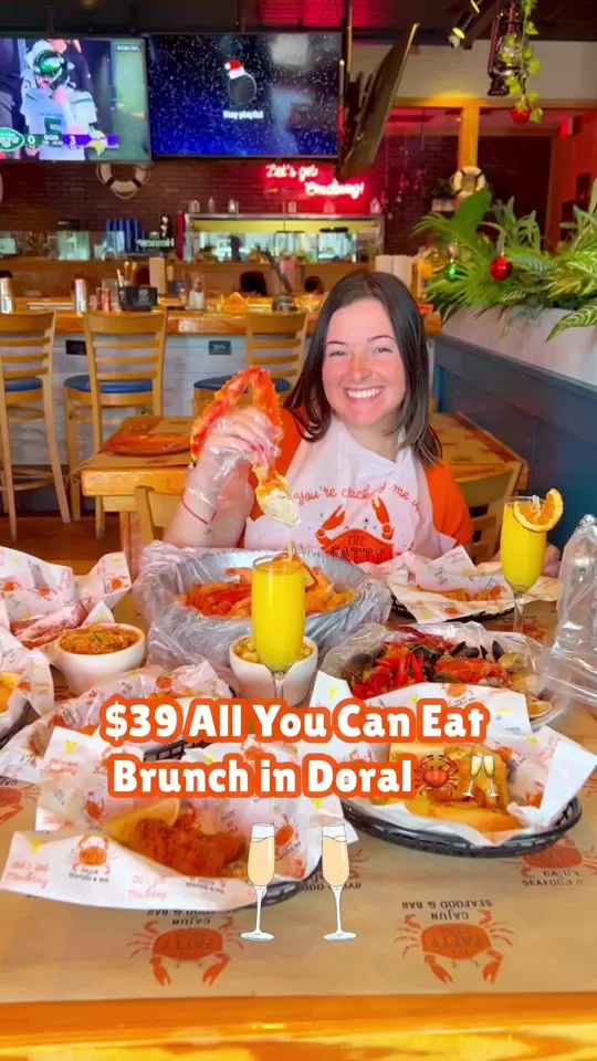 The Fatty Crab in Doral showing brunch, all you can eat, king crab, cajun boil, bottomless mimosa, video by treatyoselfeverywhere on TikTok