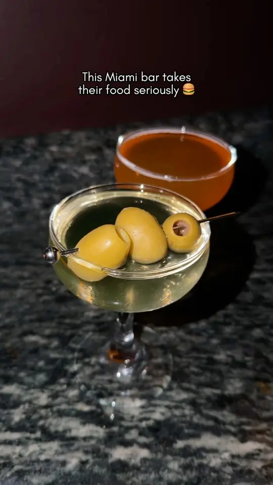 The Gibson Room in Miami showing burger, cocktail, video by Fluent in Food on YouTube