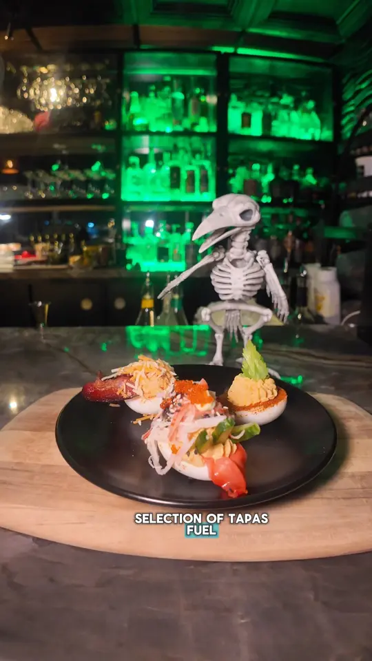 The Green Hat Bar in Fort Lauderdale showing cocktail, speakeasy experience, mysterious vibe, video by Visit Lauderdale on Facebook