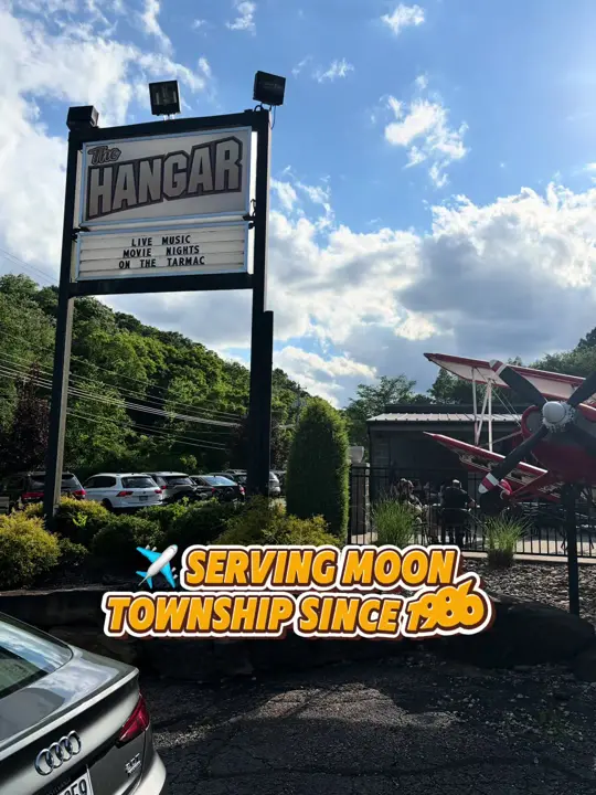 The Hangar Restaurant & Flight Lounge in St. Petersburg showing food review, fish sandwich, wings, video by stillatthetable on TikTok