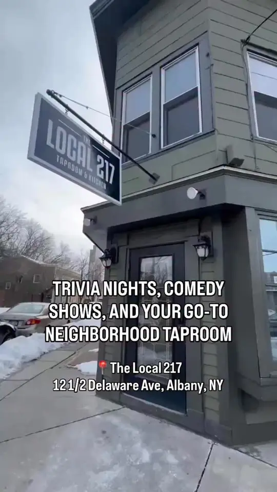 The Local 217 Taproom & Kitchen in Albany showing neighborhood bar, woman-owned business, comfort food, patio, trivia, open-mic comedy, live music, bingo, video by Lark Street Business Improvement Distric on Facebook