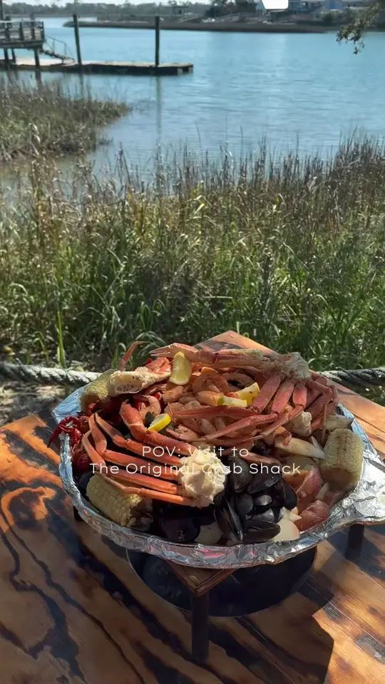 The Original Crab Shack in Tybee Island showing waterfront views, boiled seafood, slow-roasted barbecue, tropical drinks, exotic birds, baby gators, video by The Original Crab Shack on Facebook