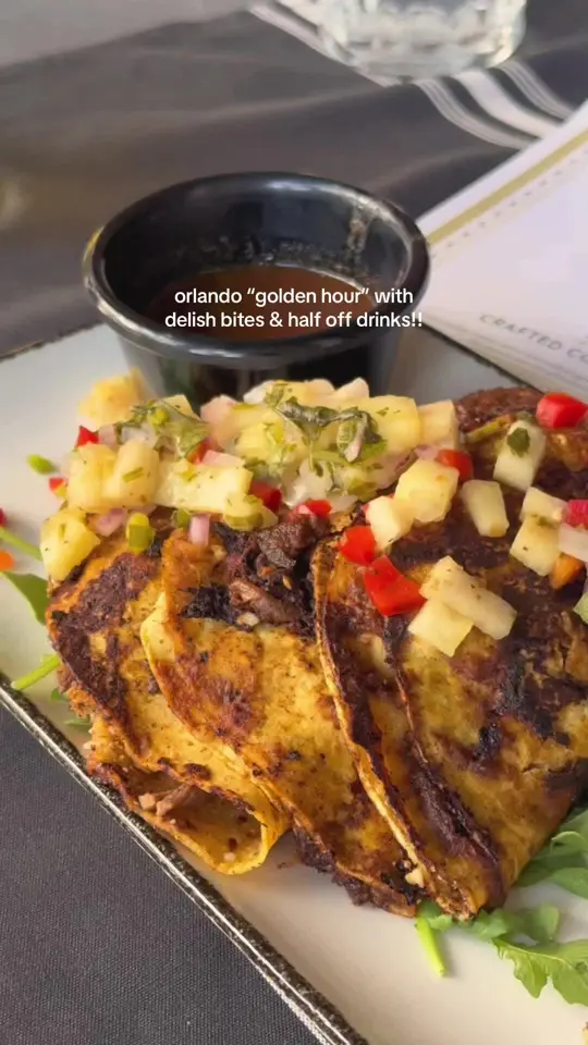 The Pinery in Orlando showing cocktail, fish tacos, zucchini frites, video by oliviashannonwolk on TikTok