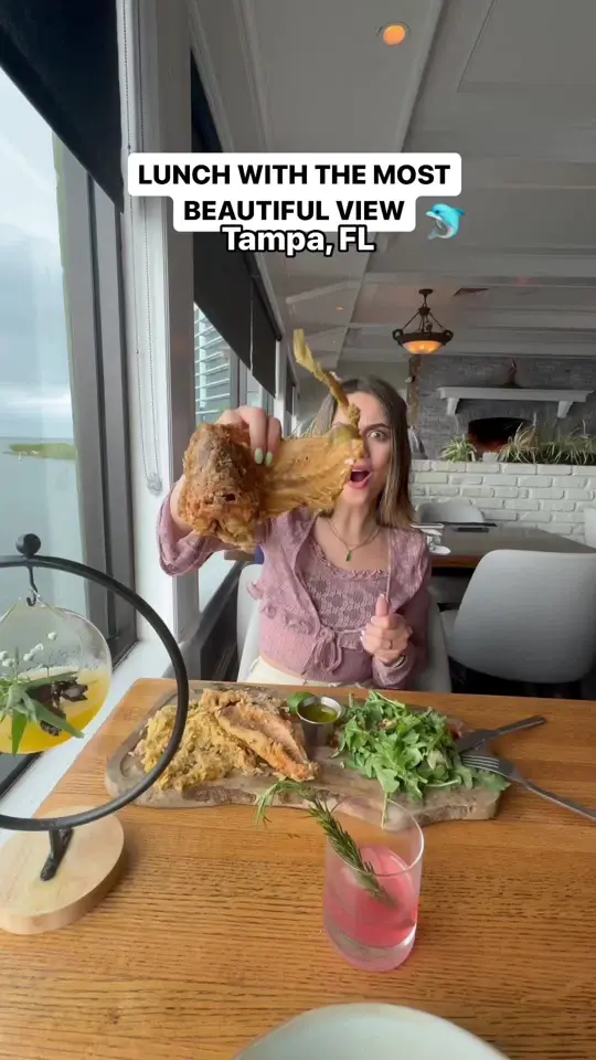 The Rusty Pelican in Tampa showing lunch, seafood, red snapper, atlantic salmon, raw oysters, fried calamari, video by foodbytiana_ on TikTok