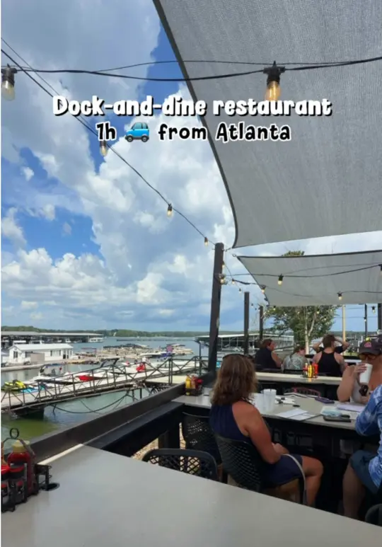 The Twisted Oar in Buford showing review, marina views, food, drinks, live music, video by the.travel.ksu on TikTok