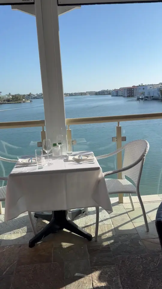  in Florida showing waterfront table, dining, views, video by venetianvillage on TikTok