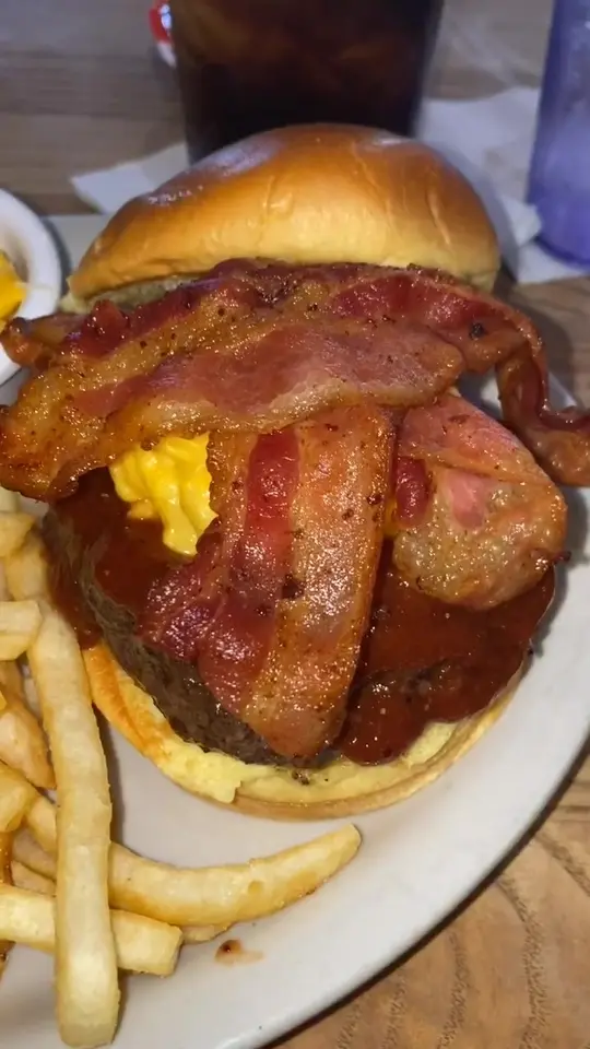 The Vortex Bar & Grill in Atlanta showing burger, restaurant visit, video by shawnthefoodsheep on TikTok
