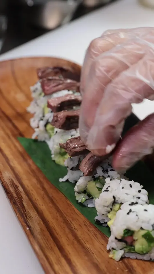 The Wagyu Bar in Coral Gables showing appetizer, guacamole sushi roll with usda prime outside skirt steak and chimichurri, video by thewagyubar on TikTok
