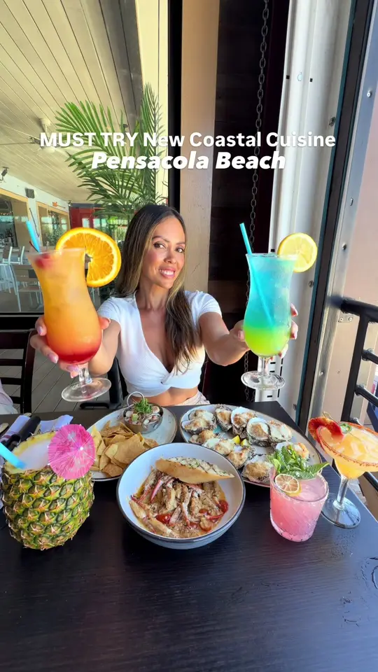The Wharf Fish & Oyster Company in Pensacola Beach showing oysters, sautéed crab claws, beachfront dining views, video by the850foodie on TikTok