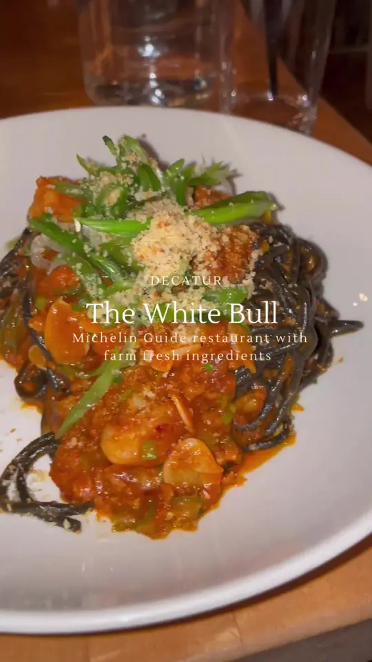 The White Bull in Decatur showing review, sfincione, black spaghetti, video by thegreedygirls on TikTok