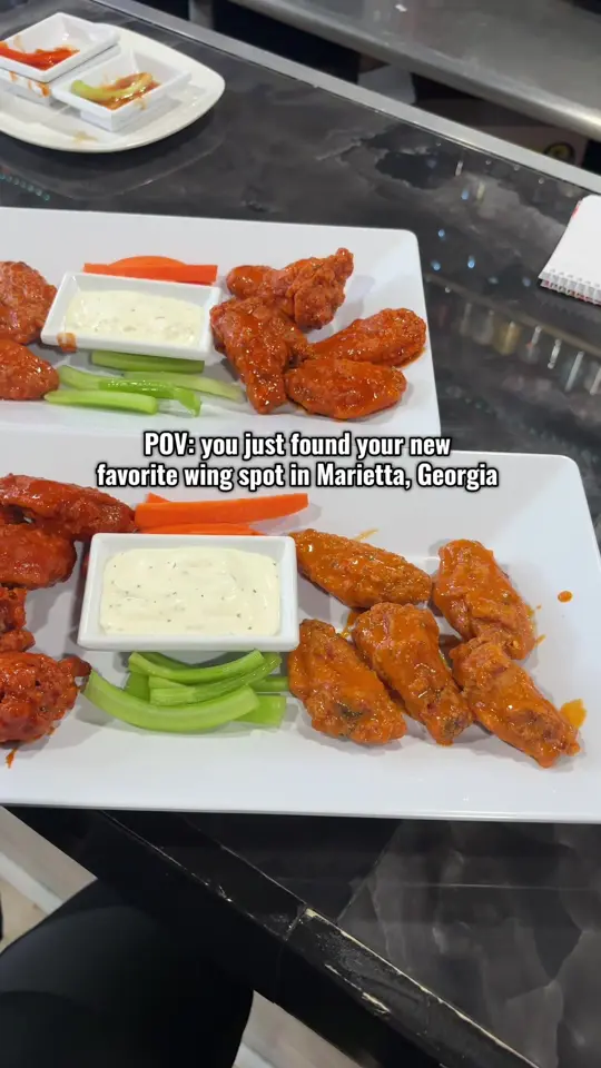 The Wing Man Marietta in Marietta showing hot wings, sports bar vibes, video by rheanaelyse on TikTok