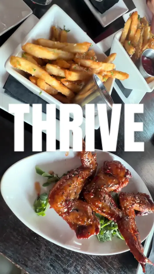 Thrive in Atlanta showing food, thai chili, lime wings, chicken potstickers, lemon parm fries, video by expensiiveramen on TikTok