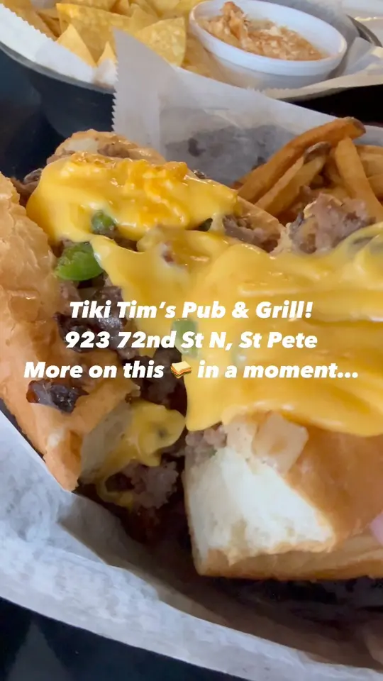 Tiki Tim’S Pub And Grill in St. Petersburg showing food, cheesesteak, hot blue crab dip, kids menu, atmosphere, visit, video by Loving St Pete on Facebook