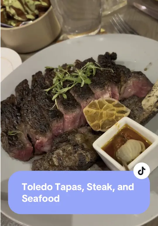 Toledo - Tapas, Steak & Seafood in Lake Buena Vista showing review, visit, video by plussizeparkhoppers on TikTok
