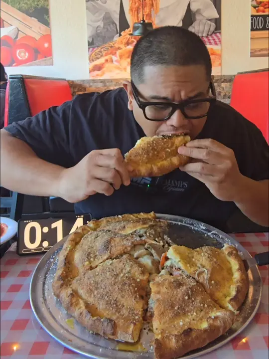 Tomasino's Pizza - Chuluota in Orlando showing pizza, stuffed pizza challenge, food review, video by waynealgenio on TikTok