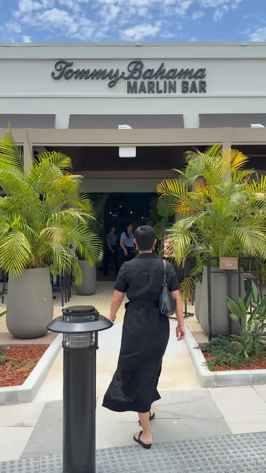 Tommy Bahama Marlin Bar in Fort Lauderdale showing cocktail, pea curious, appetizer, coconut shrimp, taco, ahi tuna tacos, flatbread, margherita flatbread, salad, grilled chicken and mango salad, dessert, key, video by Take A Bite Out Of Boca on Facebook