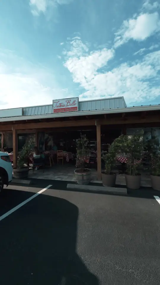 Trattoria Bella in Palm Bay showing review, cozy old-school italian feel, four cheese pasta, cheese wheel, video by brevardliving on TikTok