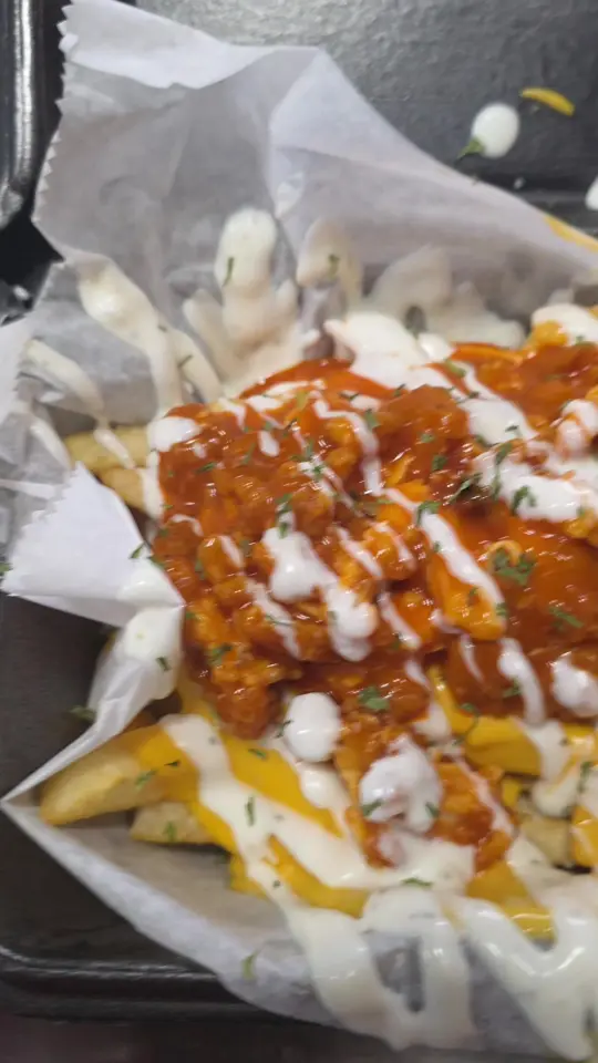 Tropical Flava in Macon showing loaded chicken fries, wing sauce, video by maconwaterice3 on TikTok