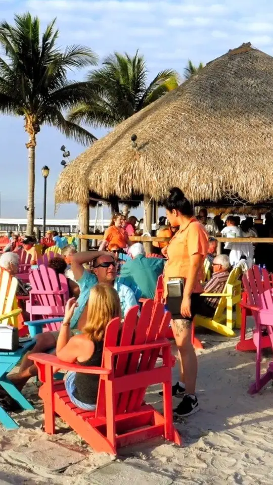 TT's Tiki Bar in Punta Gorda showing cocktail, food, live music, sunset, video by Punta Gorda/Englewood Beach on Facebook