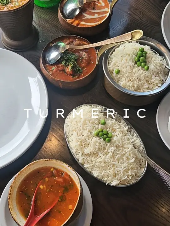 Turmeric Indian Bar & Grill in Sarasota showing review, visit, butter chicken, daal tadka, tomato rassam soup, lamb roghan josh, basmati rice, paneer pakora, cocktail, video by fashiontolive on TikTok