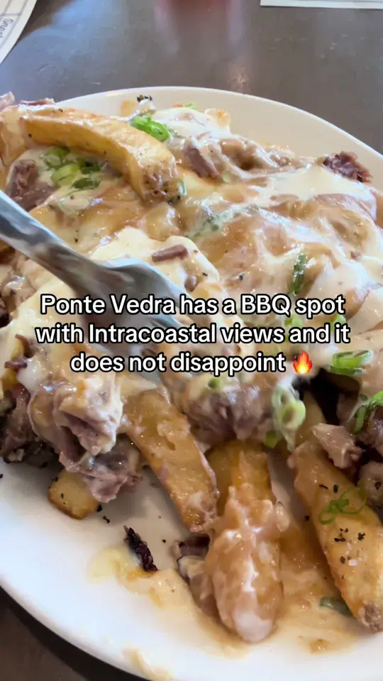 Valley Smoke Restaurant in Ponte Vedra Beach showing poutine fries, brisket, pulled pork, turkey, mac and cheese, brisket baked beans, bacon garlic green beans, video by leeann.travel.lifestyle on TikTok