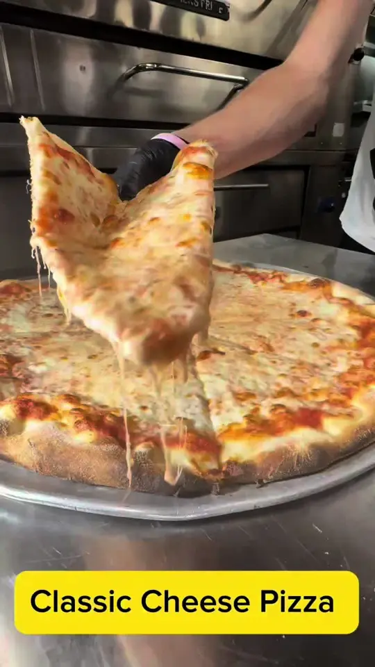 Vincenzo's of Miami in Miami showing pizza, cheese pull, video by vincenzoscucina on TikTok