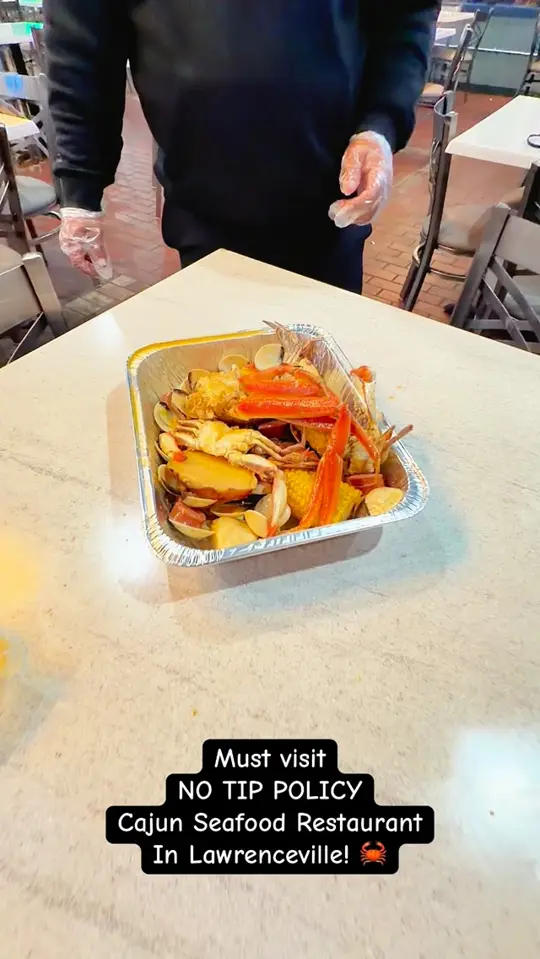 Vintages in Lawrenceville showing review, no tipping policy, cajun seafood, fried baskets, wings special, beer buckets, video by Vintage Cajun Seafood & Bar on Facebook